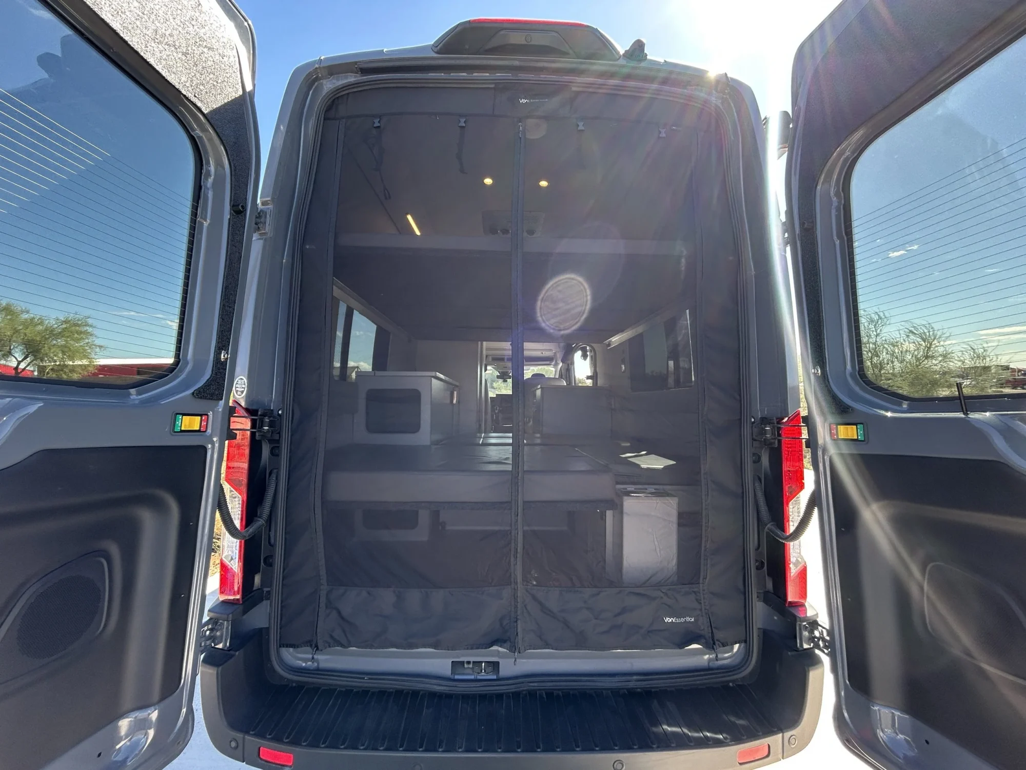 2024 Ford Transit 350 148 High Roof AWD, rear doors open with rear bug screen zipped closed