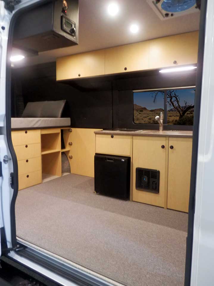 Van conversion with upgraded maple cabinets.