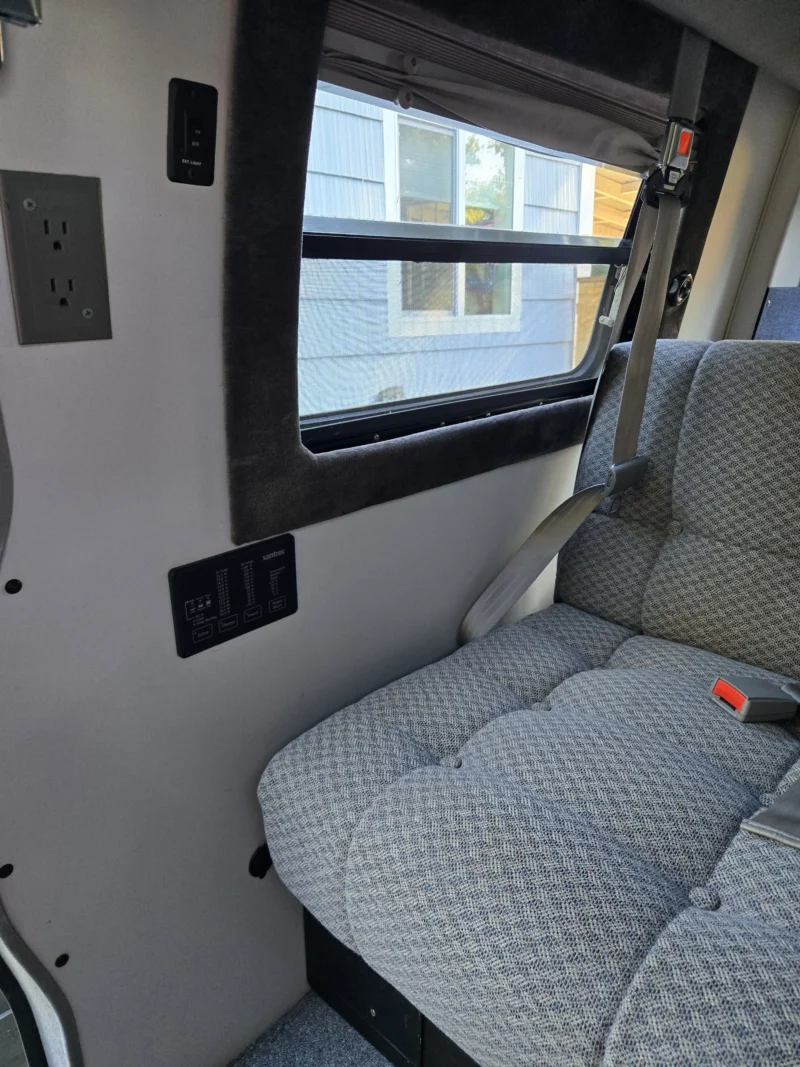 2001 Chevy Express 2500 EB50 Penthouse Top, seat by the driver-side slider window