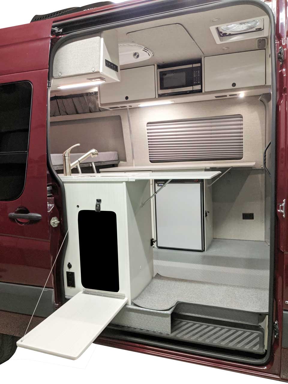 Cabinets and shelving in galley.