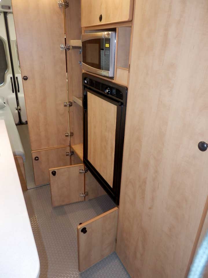 Ford Transit camper conversion with extra large cabinets.