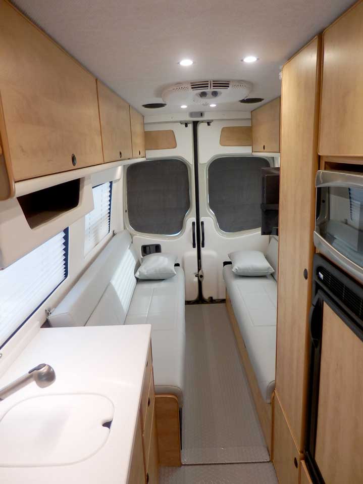 Ford Transit camper conversion with full walkway.