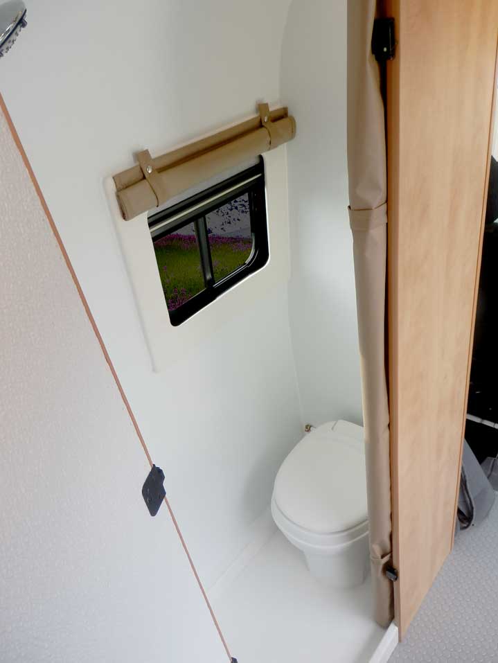 Ford Transit camper conversion with indoor toilet.