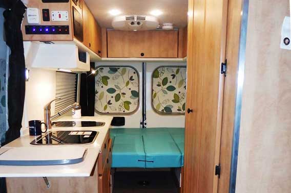 Van conversion with modern color scheme and upgraded materials.