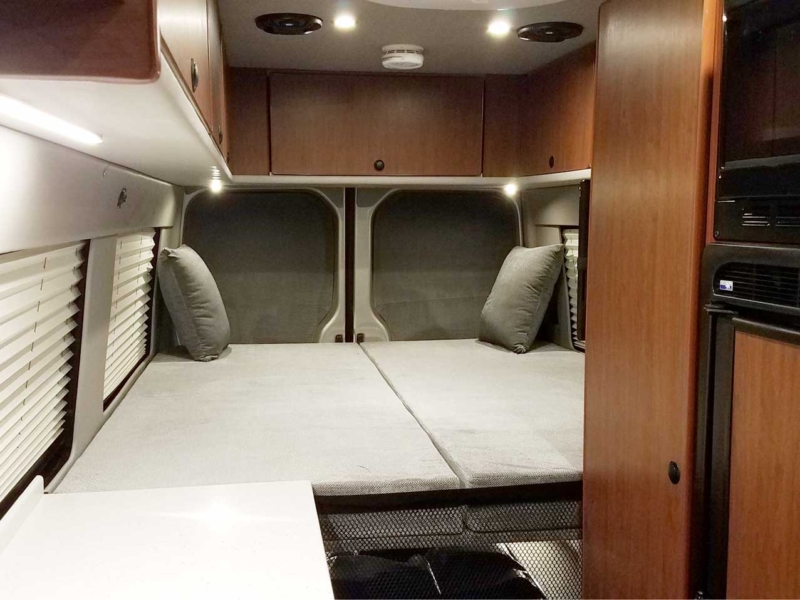 Interior view of a Sportsmobile Sprinter EB custom camper van conversion.