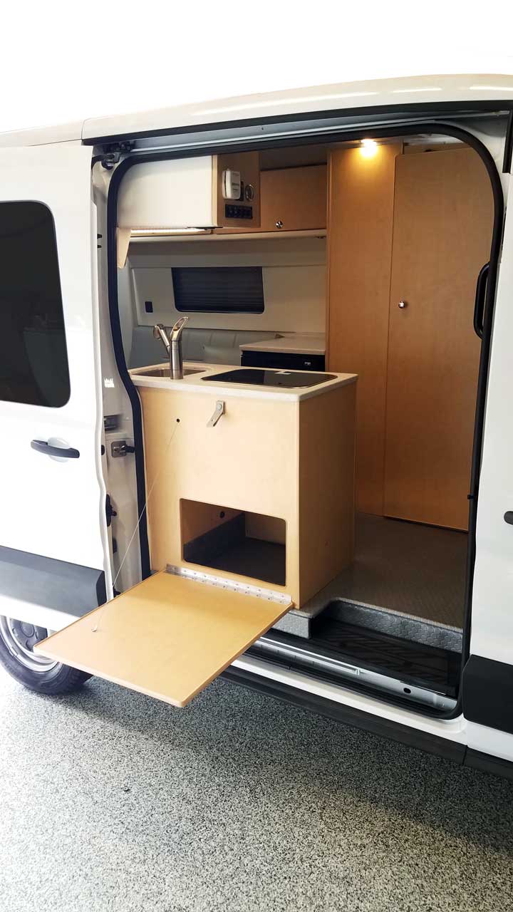 Exterior view of Transit conversion van with dropdown table extended.