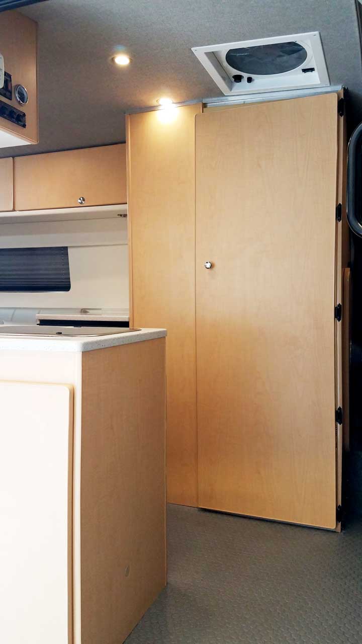 View of Transit conversion van featuring a bath compartment.