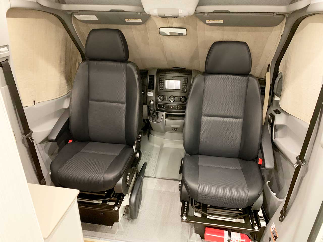 Front seats swivel for facing the interior of the van.