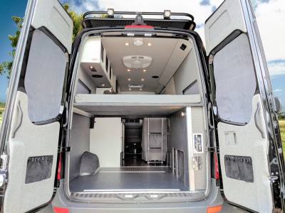 Rear storage is easily accessible from inside or outside van.