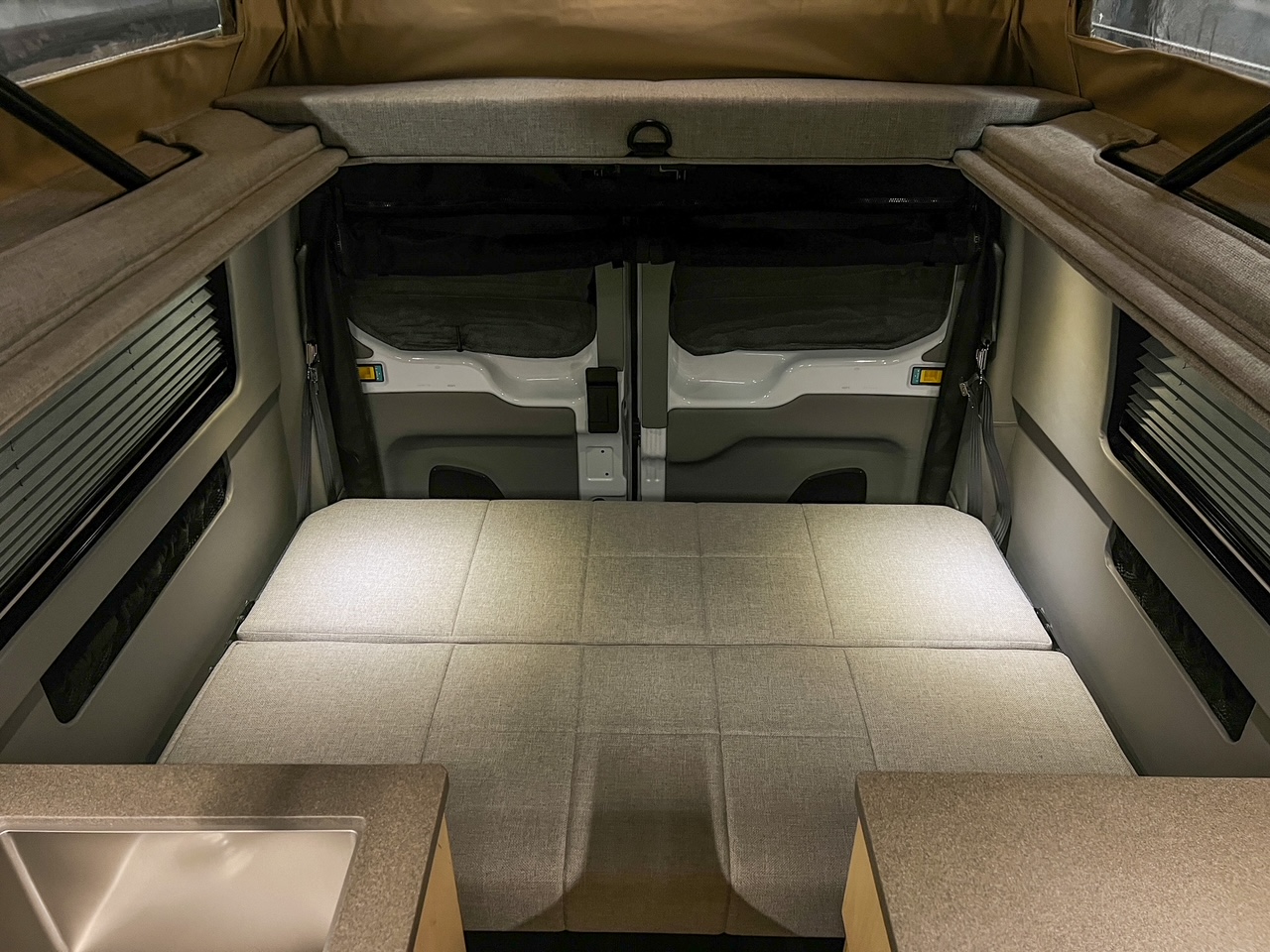 Ford Transit 130 low-roof penthouse camper van