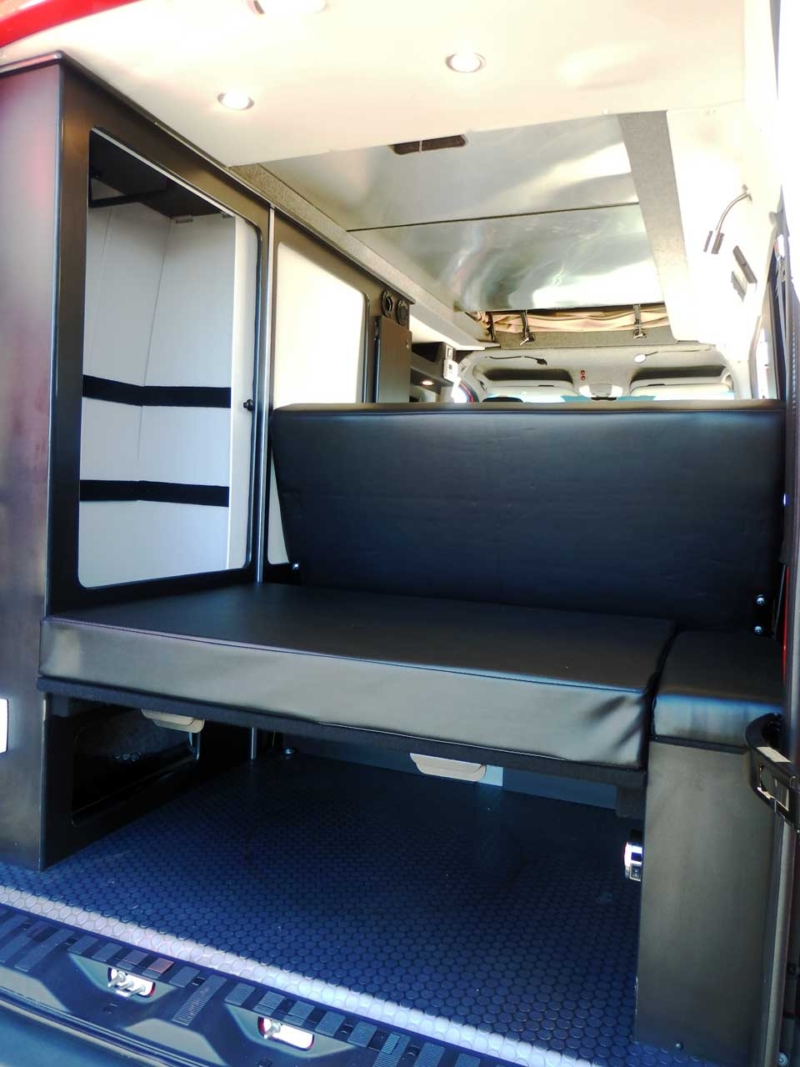Sportsmobile camper van conversion with rear leather sofa.