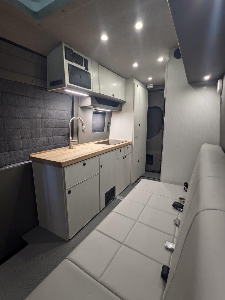 Butcher block countertop galley in Mercedes Sprinter 144 camper conversion
