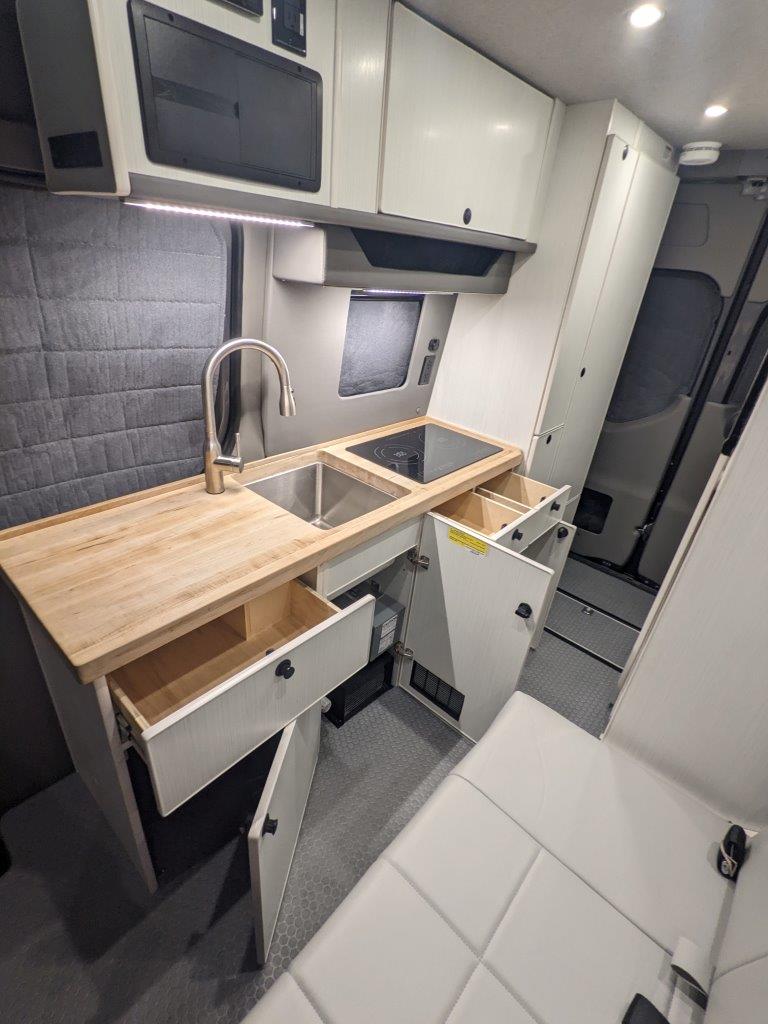Sprinter 144 camper van cabinetry and storage detail