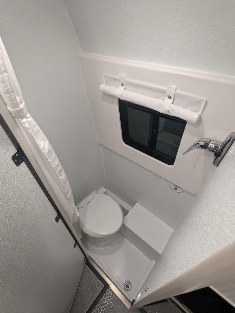 Full wet bath with macerator toilet in Sprinter 144 van conversion