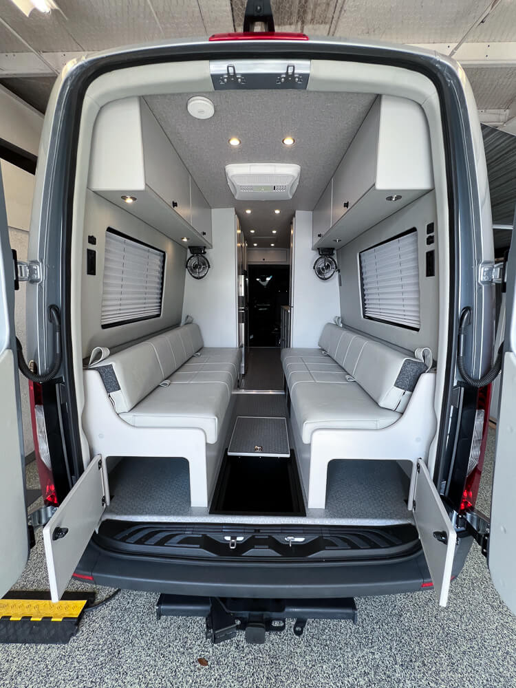 Sprinter custom camper van with large rear dinette.