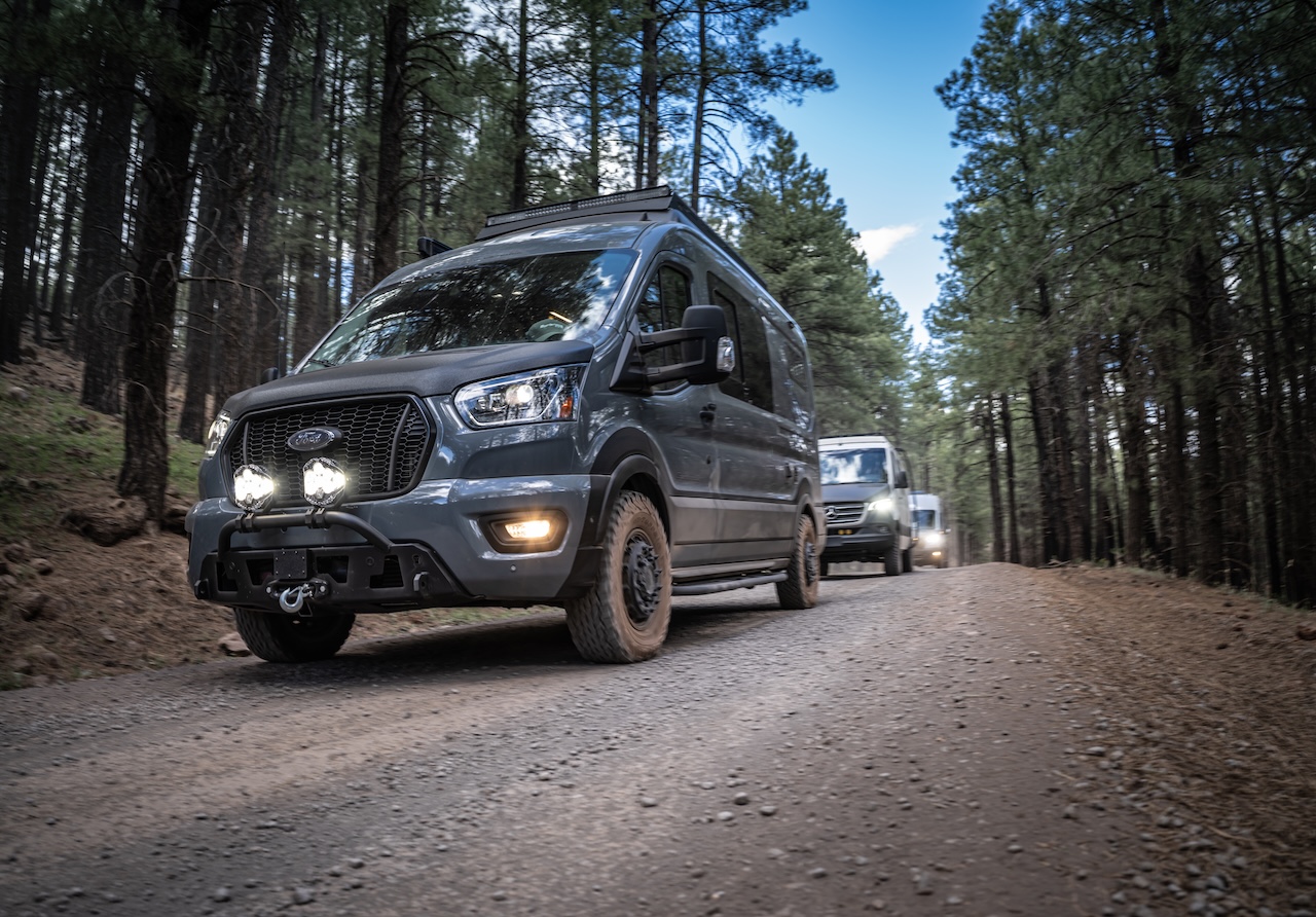 AWD Ford Transit Mid-Roof Pop Top on the trail with a conversion done by Sportsmobile.