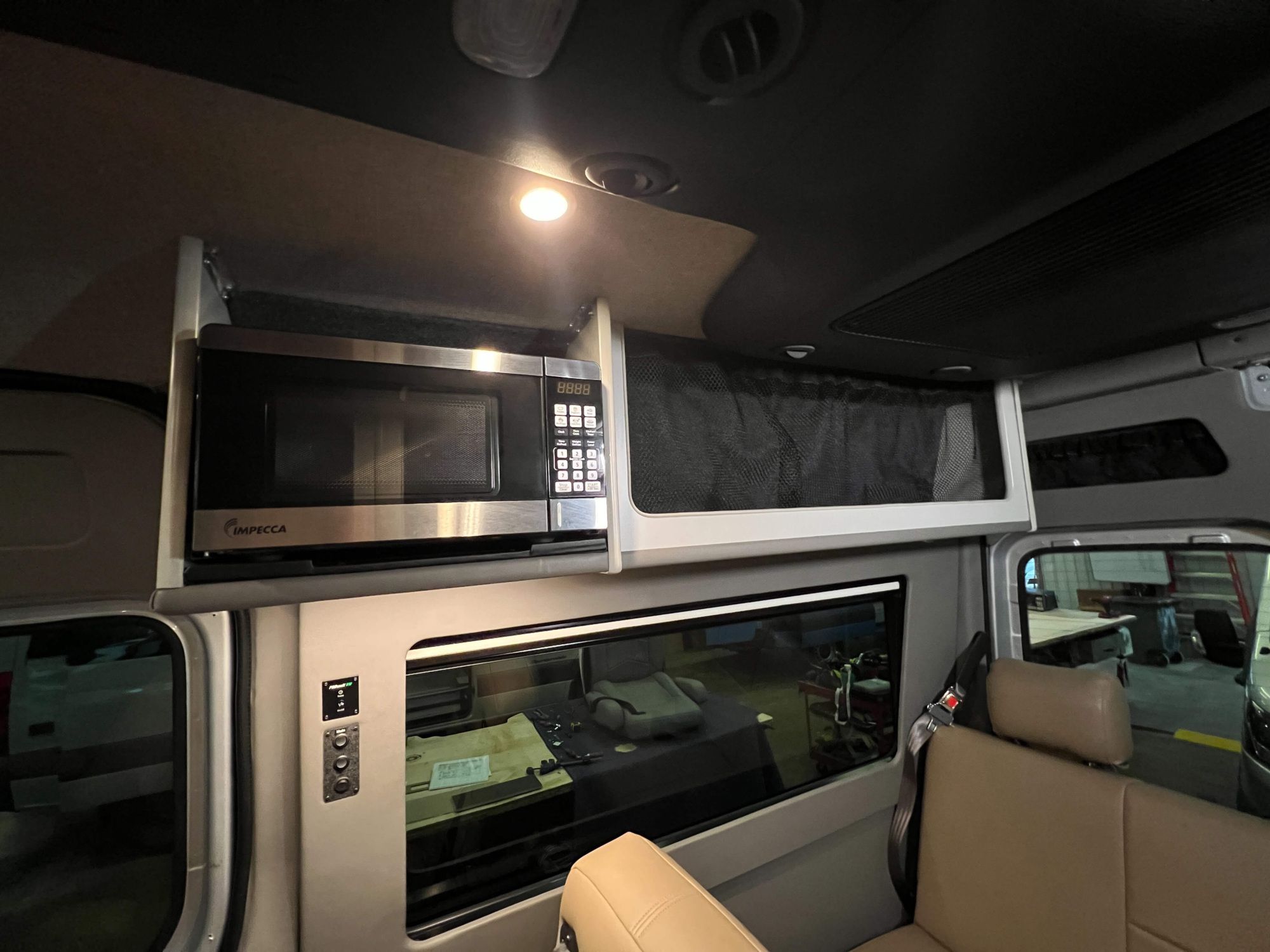 Microwave installed in custom-built Sprinter road trip van