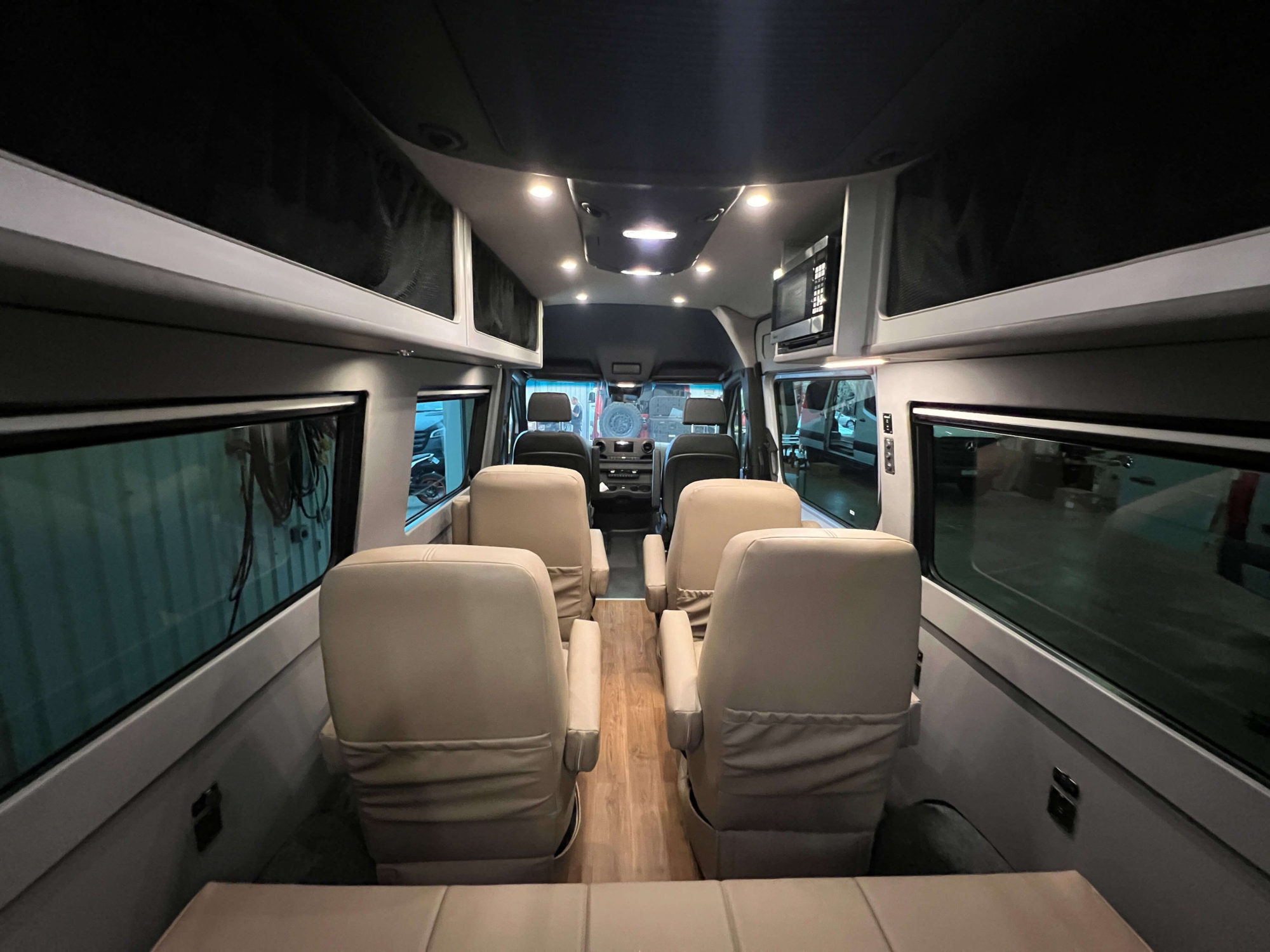 Interior view showing seating for 9 passengers with belted seats