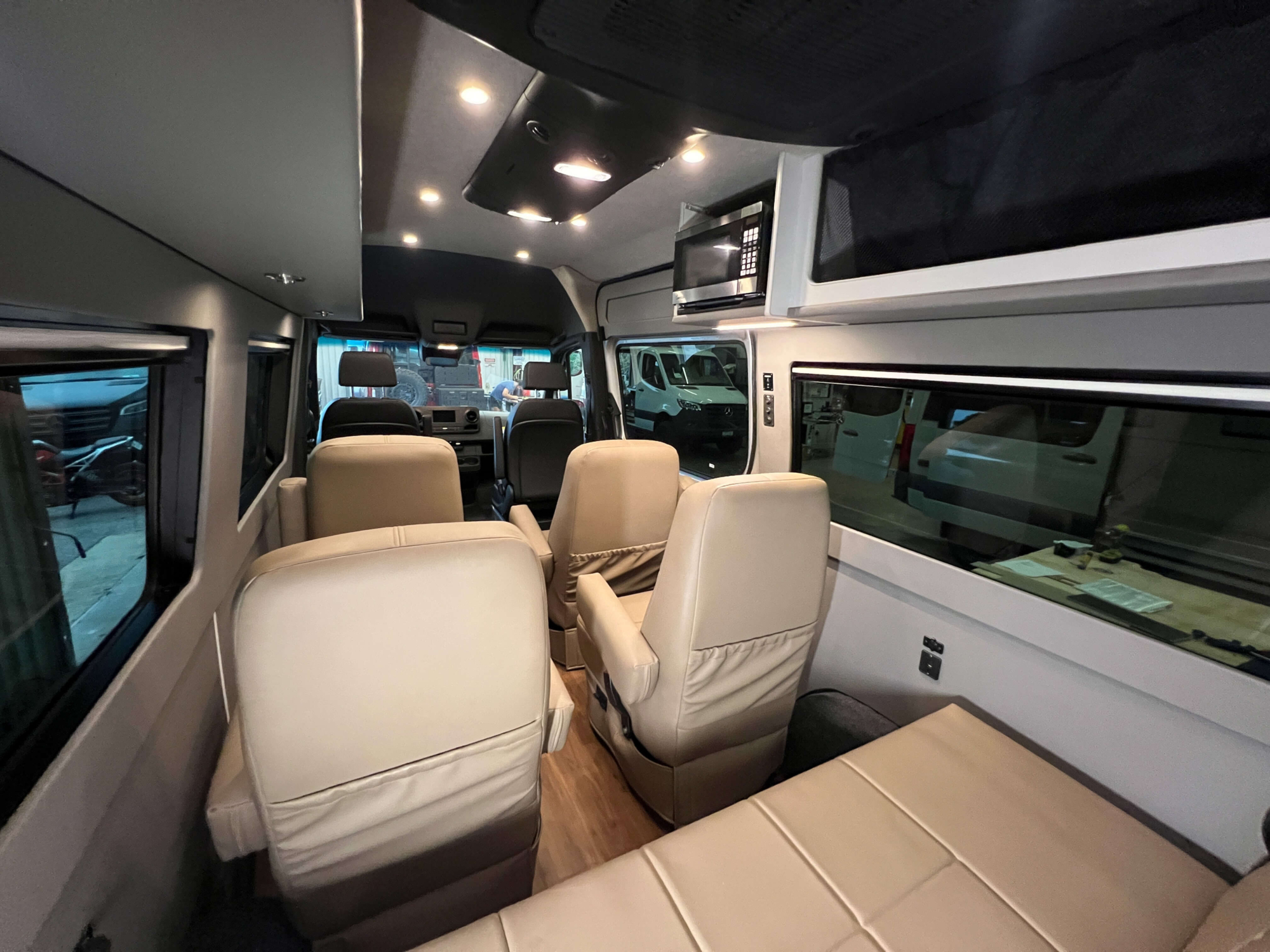 Interior view showing seating for 9 passengers with belted seats