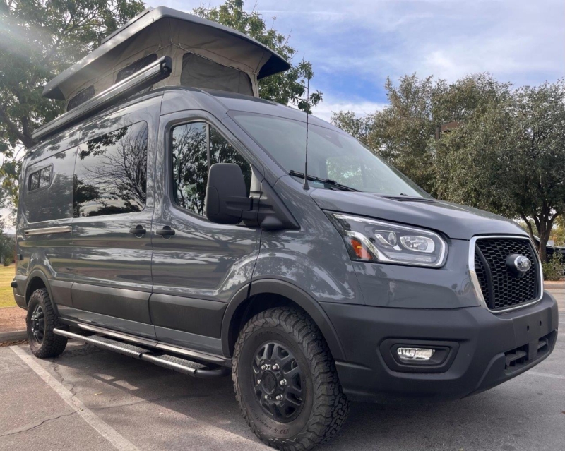 Dark grey 2022 Ford Transit MR AWD 350.