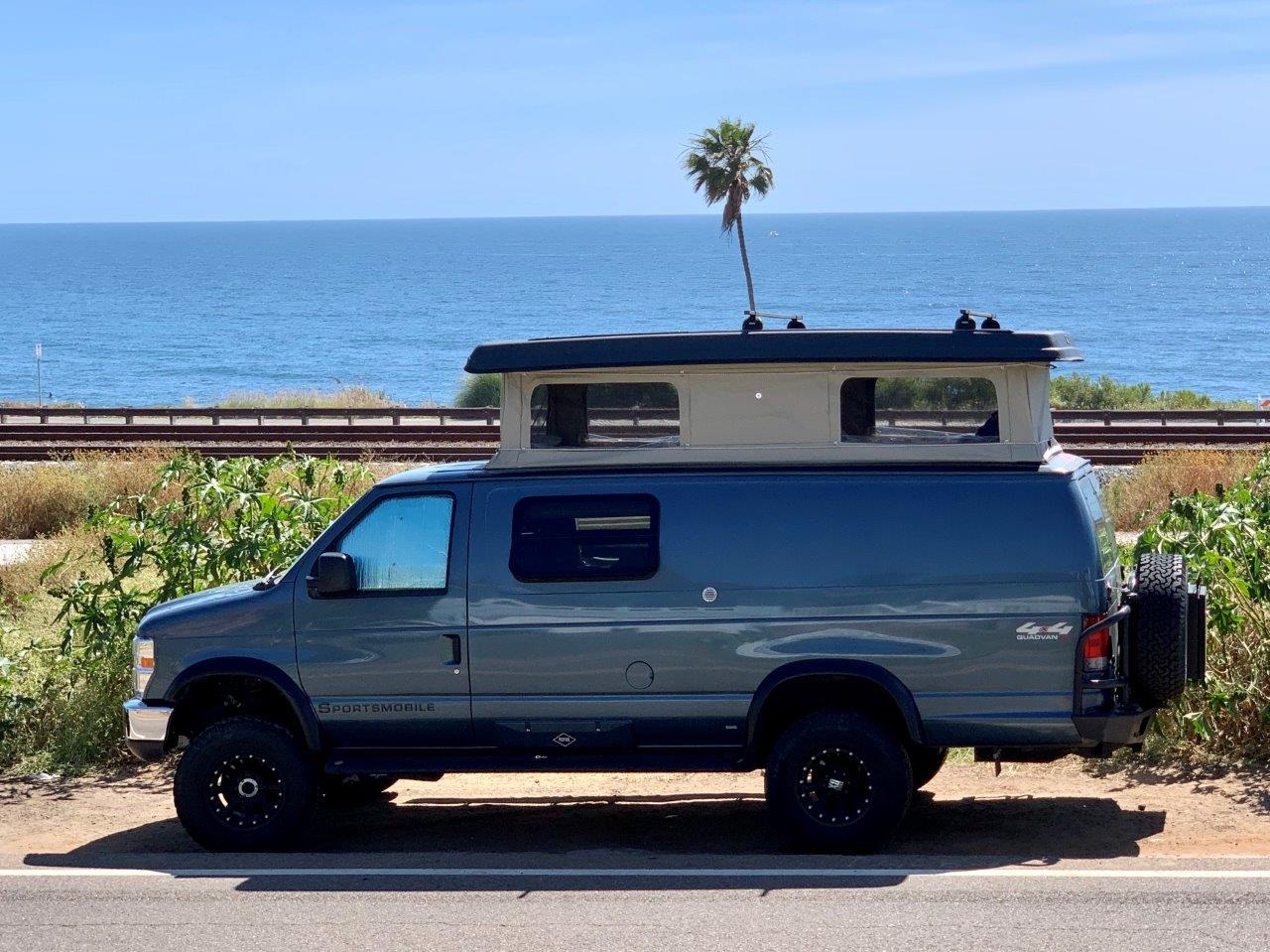 Light blue 2013 Quad Van 4x4.