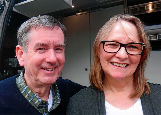 A smiling pair of older people.