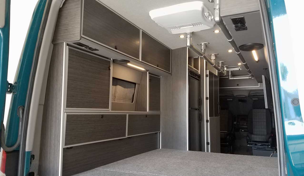 Interior view of a Sportsmobile Sprinter with plenty of cargo space.