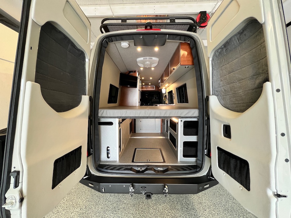 Rear view of interior of a van converted by Sportsmobile.