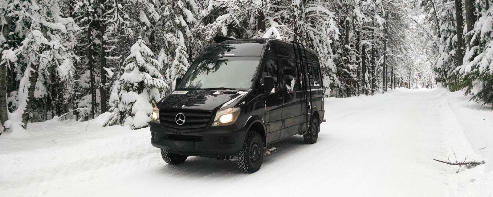 Sprinter camper van in snow.